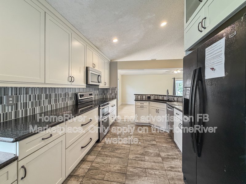Lakefront Living | Gated Community | Screened Patio with Hot Tub property image